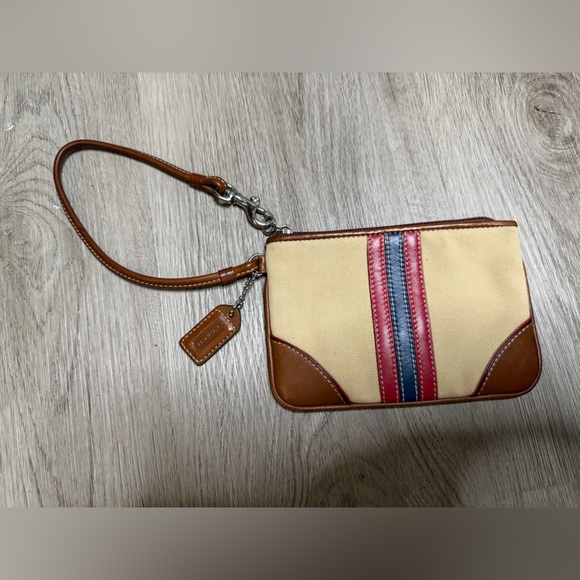 Coach Handbags - Coach Tan Canvas Wristlet with Red and Blue Stripe Accents